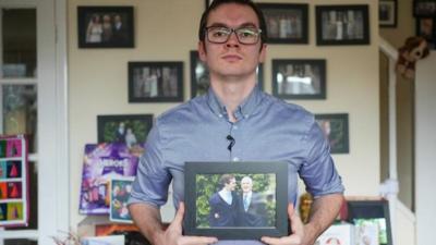 Steve Parsons holding photo of grandfather