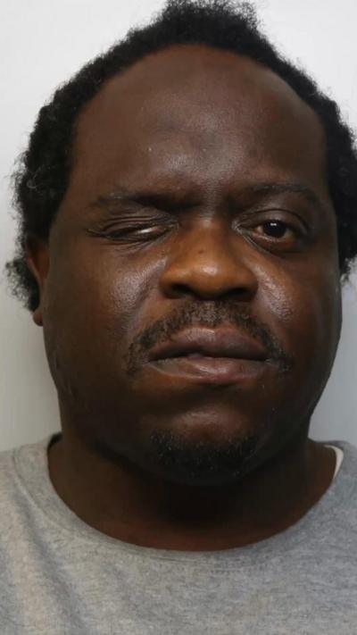 A man squinting one eye in a close-up