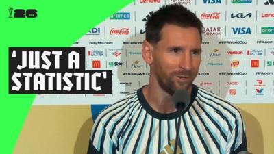 Lionel Messi speaks into a microphone following Argentina's win over Algeria