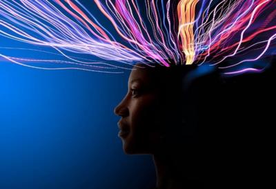 Profile image of woman with lines of light going towards her head 