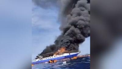 The KM III Barcelona ship catches fire in the Indonesia sea.