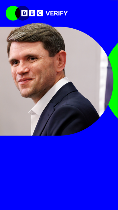 James Talrico smiles at a camera. He is wearing a dark suit and white shirt. The image is imposed over the BBC Verify colours and branding.
