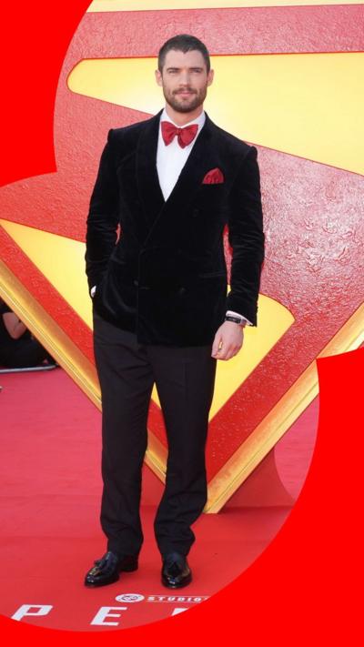 David Corenswet stands in front of the Superman logo in Leicester Square