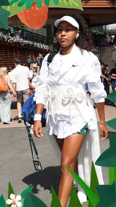 Naomi Osaka walking in white Kimono style outfit 