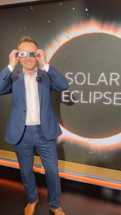 A man stands in sunglasses