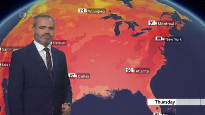 Ben Rich standing in front of a weather map of the US showing the heat