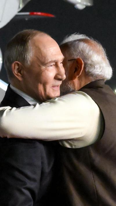 Putin being hugged by Modi