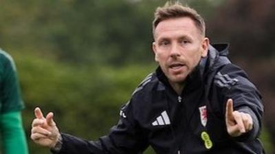 Craig Bellamy makes a point in Wales training