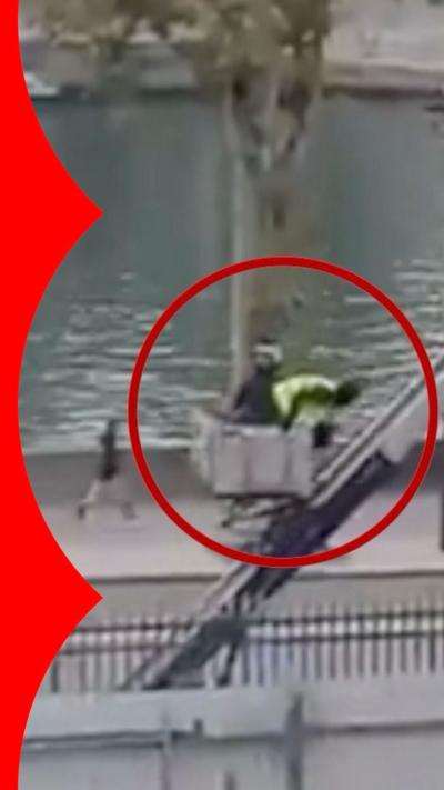 Two people leave Louvre in lift mounted to vehicle