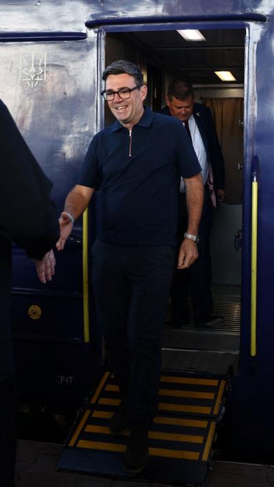 Burnham stepping off a train