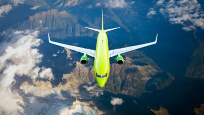 A passenger plane flying through the air