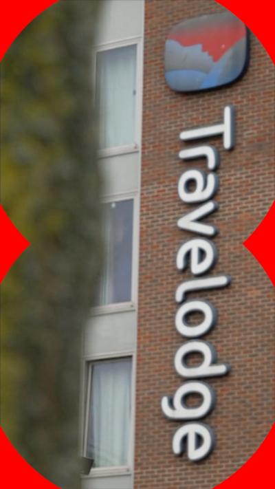 Travelodge building exterior with logo on sign