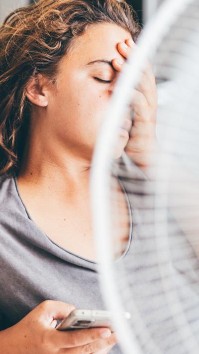 woman using electric fan