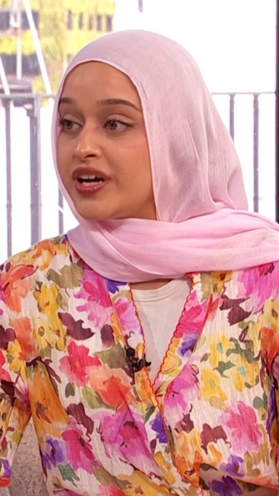 Optometrist Humaira Bham wearing a floral outfit explains how to treat bloodshot eyes