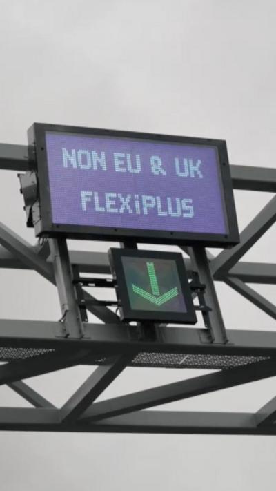 A sign directing traffic, saying "Non EU & UK Flexipass"