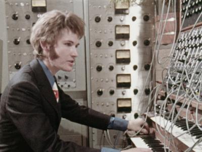 Wendy Carlos sits at the keyboard of a Moog Synthesiser.