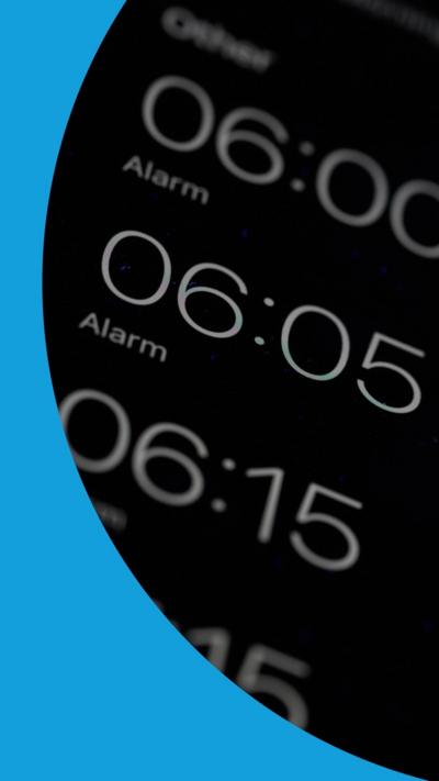 A mobile phone screen with four different alarms 