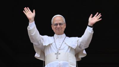 Pope Leo XIV waves and smiles