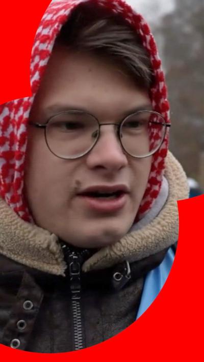 A young man with glasses