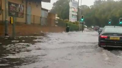 Car driving through flood water