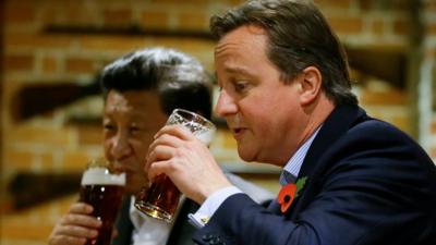 David Cameron drinks a pint of beer with Chinese President Xi Jinping, at a pub in Princess Risborough near Chequers