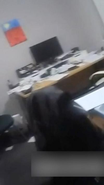 Vertical image showing a cluttered desk