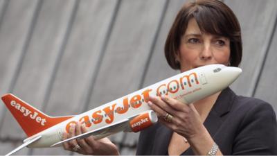 Carolyn McCall holding an Easyjet plane model