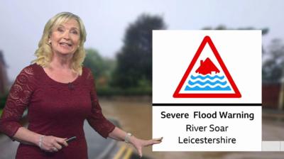 BBC Weather presenter Carol Kirkwood points to a graphic for a severe flood warning in Leicestershire