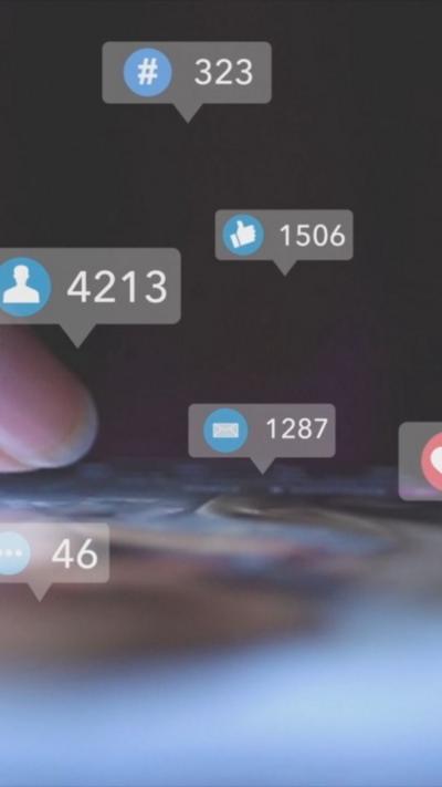 Graphic image of likes and follow icons popping out of a phone screen