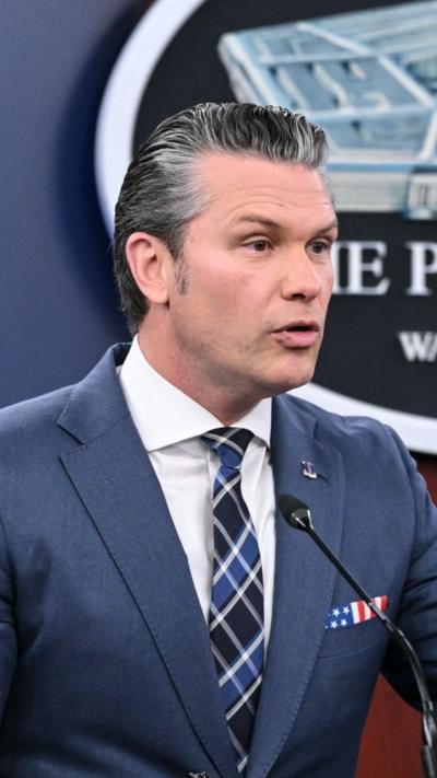 Pete Hegseth speaks to reporters. 