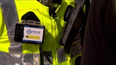 Police officer with a body worn camera