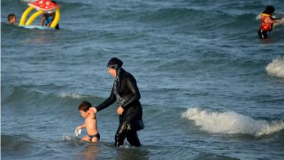 A woman wearing a burkini