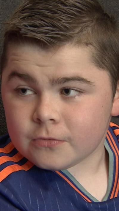 Alfie Pentony, in blue Newcastle United football shirt, 