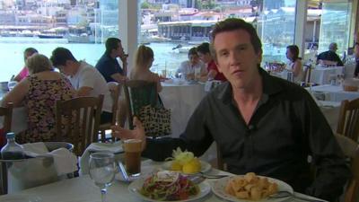 The BBC's Mark Lowen in a Greek taverna