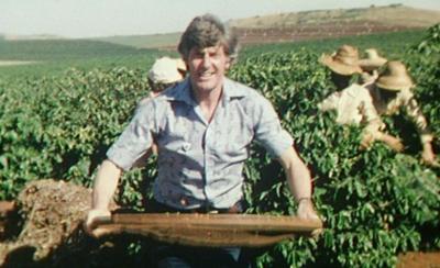 Peter Purves with a sieve to separate beans from leaves, on a coffee farm.