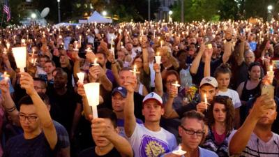 Crowd holding candles