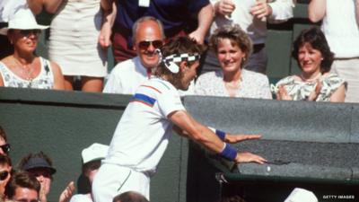 Wimbledon archive: Part Cash climbs into crowd after win