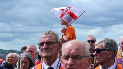 People attending the centennial parade in Belfast