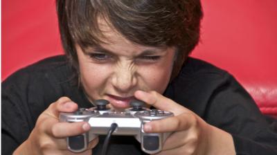 image of kid playing a video game