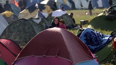 Woman and child at migrant camp in Idomeni, Greece