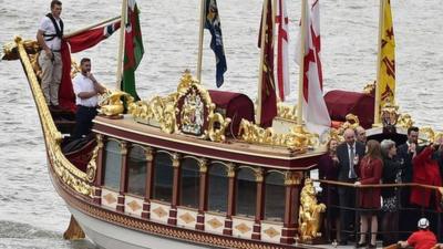 The Royal Barge Gloriana leads a procession along the River Thames to pay tribute to Queen Elizabeth becoming Britain's longest-reigning monarch