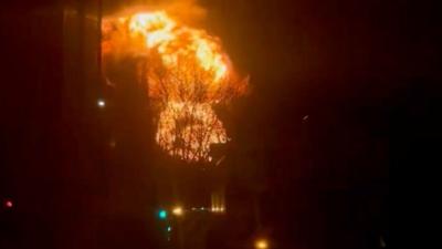 Large fire billowing into night sky