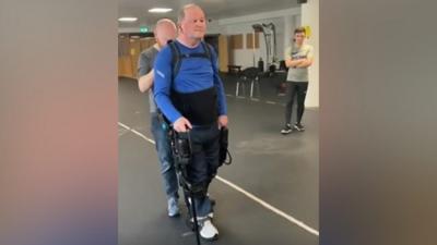 Sean Cox in an exoskeleton