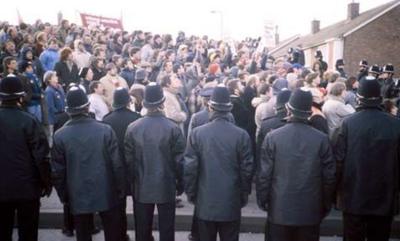 Striking miners and police