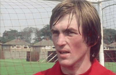 Kenny Dalglish in Liverpool red talking about his upcoming debut