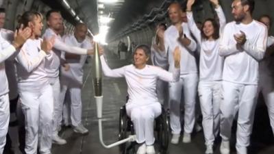 French athletes with paralympic flame in Channel Tunnel