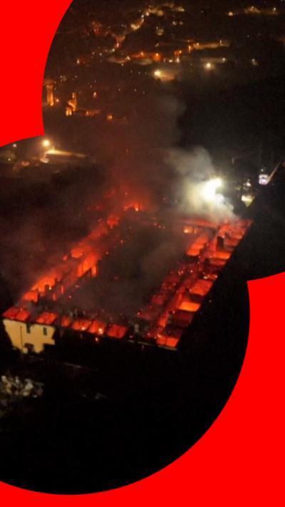 Aerial view of monastery on fire 