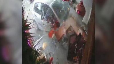 CCTV of moment car smashed into shop