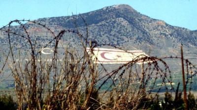 Turkish flags on mountain seen from Green Line