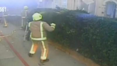 Firefighters outside a flat explosion